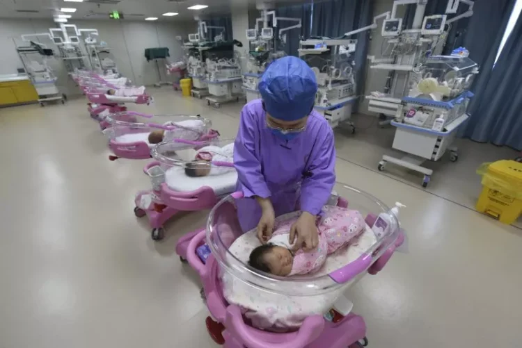 File photo of a nurse taking care of newborn babies in a maternity hospital in Fuyang in central China's Anhui province Monday, Aug. 08, 2022. AP