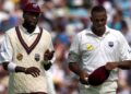 Sir Curtly Ambrose (L) and Courtney Walsh (R), of the West Indies, walk together during the first session of the Fifth Test against England at The Oval in London, 31 August 2000.