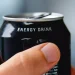 Stock image of someone holding an energy drink.
Getty