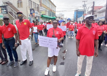 GTUC Organising Secty Eon Andrews (third from left) and GTUC President Norris Witter (far right)
