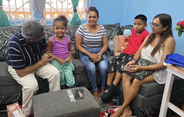 Former Mayor Ubraj Narine left with the children who were attacked by acid and their families.