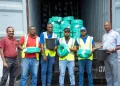 Packed and ready to go. (L-R) Production Manager, Chockalingam Ramasamy; Warehouse Attendants, Krachike Lyn, Shaquile Drummond, Prince Ellis and Phillip Lyons; and Warehouse Manager, Daniel Chambers, prepare the first shipment of Omni’s products to Guyana.