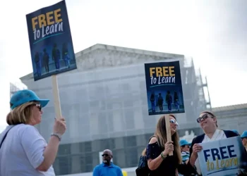 Supporters hold signs as they gather outside the U.S. Supreme Court on April 30, 2025, in Washington. Alex Wong/Getty Images