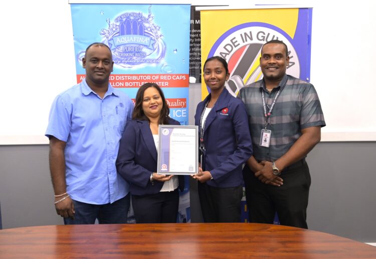Aquafina Director, Nalini Latchana receives Made in Guyana Certificate from GNBS Technical Officer, Rachel Cecil