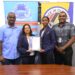 Aquafina Director, Nalini Latchana receives Made in Guyana Certificate from GNBS Technical Officer, Rachel Cecil