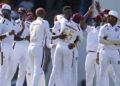 Teammates congratulare West Indies' Alzarri Joseph after he dismissed Australia's Usman Khawaja on day two of the first cricket Test match at Kensington Stadium in Bridgetown, Barbados, Thursday, June 26, 2025. (AP Photo/Ricardo Mazalan)