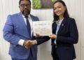 Director of Local Content Secretariat, Dr. Martin Pertab hands over Letter of Approval to MODEC Corporate Manager, Kim Huynh