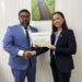 Director of Local Content Secretariat, Dr. Martin Pertab hands over Letter of Approval to MODEC Corporate Manager, Kim Huynh