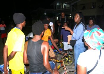 Presidential candidate Amanza Walton-Desir (centre) on the campaign husting, speaking to young people at an East Berbice-Corentyne outreach