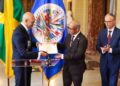 Jamaica’s Ambassador to the United States and Permanent Rep to the OAS, Major Gen. (Rtd) Anthony Anderson presents his credentials to the Secretary General of the OAS, H. E. Albert Ramdin on June 18. At left is Assistant Secretary General , Amb Nestor Mendez. | Derrick Scott Photo.