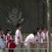 Chinese students wait outside the U.S. Embassy for their visa application interviews, in Beijing on May 2, 2012. Alexander F. Yuan/AP