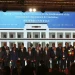 Chinese Foreign Minister Wang Yi, Center,  attends the signing ceremony of the "Convention of the Establishment of the International Organization of Mediation", in Hong Kong, Friday May 30, 2025 (AP Photo/Johnathon  Lee)