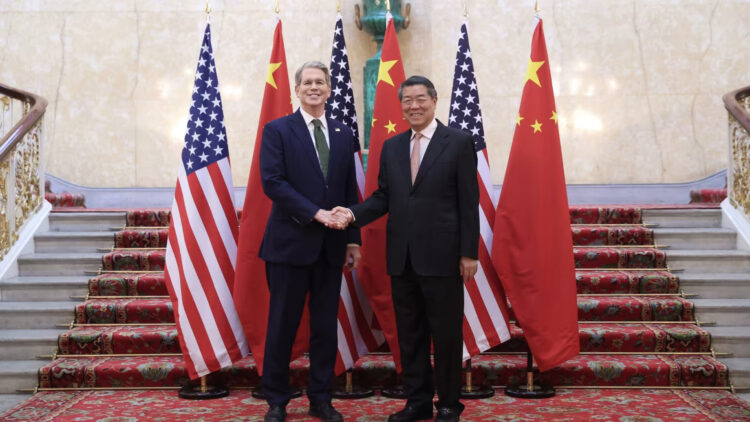 Chinese Vice Premier He Lifeng shakes hands with US Treasury Secretary Scott Bessent in London on Monday. Li Ying/Xinhua/Getty Images