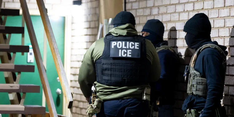 Immigration and Customs Enforcement officers wait to detain a person, Jan. 27, 2025, in Silver Spring, Md.Alex Brandon / AP file