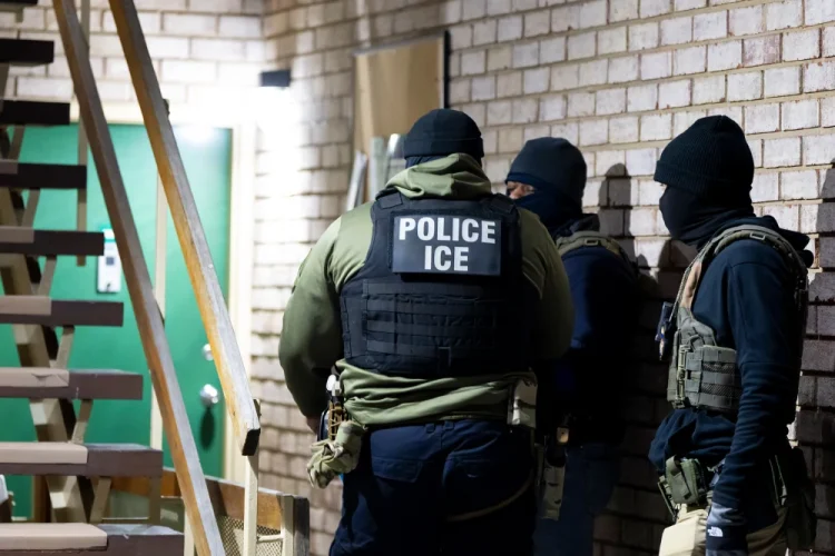 Immigration and Customs Enforcement officers wait to detain a person, Jan. 27, 2025, in Silver Spring, Md.Alex Brandon / AP file