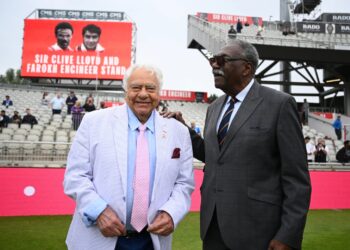 Farokh Engineer (left) and Sir Clive Lloyd share a moment in front of the newly re-named stand.