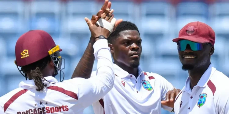 Alzarri Joseph (centre) impressed with 4-61 on day one in Grenada