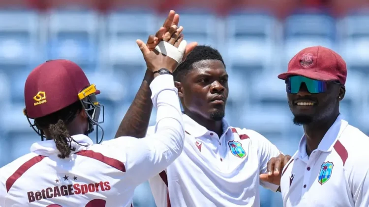 Alzarri Joseph (centre) impressed with 4-61 on day one in Grenada