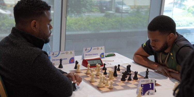 FM Joshua Johnson of Trinidad (L) facing FM Joshua Christie (Jamaica)