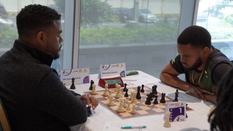 FM Joshua Johnson of Trinidad (L) facing FM Joshua Christie (Jamaica)