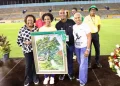 Sprint great Shelly-Ann Fraser-Pryce (second left) is joined by Minister of Sport Olivia Grange (left), JAAA president Garth Gayle (third left), and Wolmer’s High School for Girls principal Colleen Montague during a tribute following her third-place finish in the women’s 100m final at the Jamaica Trials on Friday, marking her final appearance at the national championships. She has already indicated that 2025 will be her final season. (PHOTO: Marlon Reid).