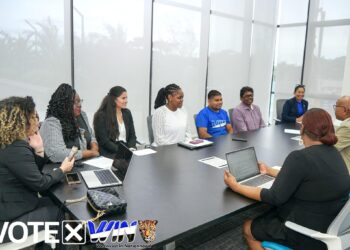 WIN delegation (left) meeting the Commonwealth Delegation. WIN Presidential Candidate Azruddin Mohamed in WIN t-shirt