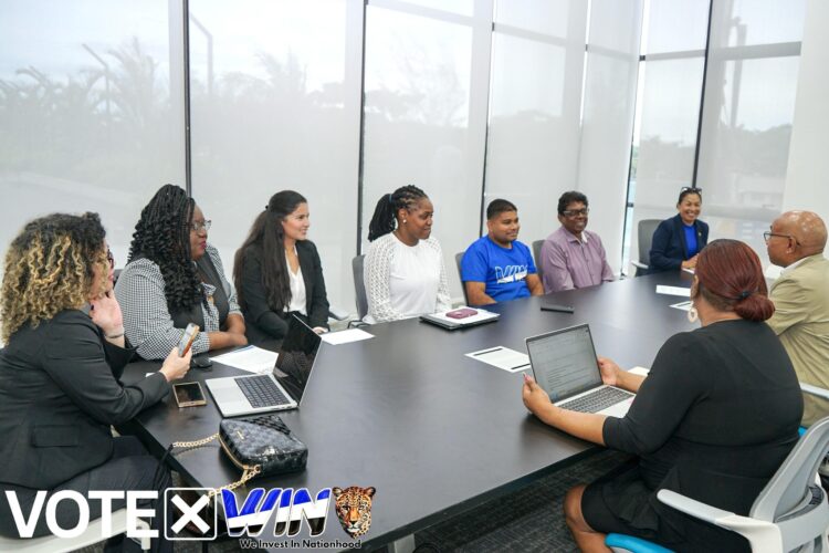 WIN delegation (left) meeting the Commonwealth Delegation. WIN Presidential Candidate Azruddin Mohamed in WIN t-shirt