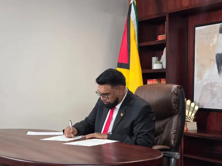 President Dr. Irfaan Ali signs the proclamation dissolving Parliament.
