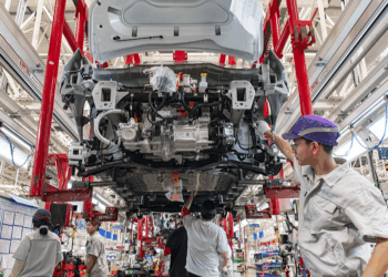 Workers assemble new energy vehicles at a smart factory in Jinhua, Zhejiang Province, China, June 24, 2025. /VCG
