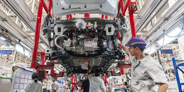 Workers assemble new energy vehicles at a smart factory in Jinhua, Zhejiang Province, China, June 24, 2025. /VCG