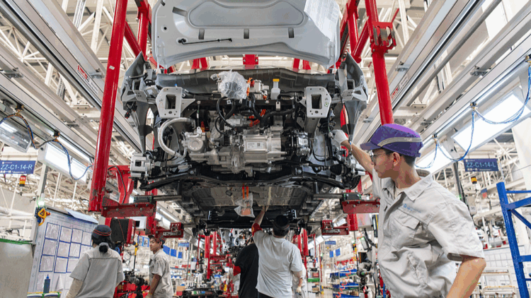 Workers assemble new energy vehicles at a smart factory in Jinhua, Zhejiang Province, China, June 24, 2025. /VCG