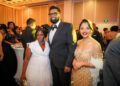 L-R an attendee/staff, President Irfaan Ali and First Lady Arya Ali at the Diamond Ball, December 2024 Facebook Photo)