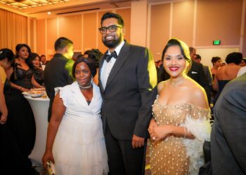 L-R an attendee/staff, President Irfaan Ali and First Lady Arya Ali at the Diamond Ball, December 2024 Facebook Photo)
