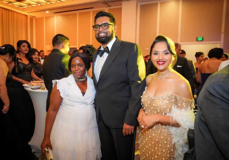 L-R an attendee/staff, President Irfaan Ali and First Lady Arya Ali at the Diamond Ball, December 2024 Facebook Photo)