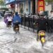 Residents commute in the rain in Jinhua City, east China's Zhejiang Province, July 11, 2025. /VCG