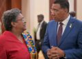 Barbados PM Mia Mottley converses with Jamaica's PM Andrew Holness at the CARICOM meeting in Montego Bay July 7, 2025