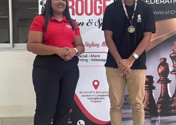 2025 National Junior Chess Championship qualifier Winner Kyle Couchman with Rouge Salon and Spa's Pritima Balgobin