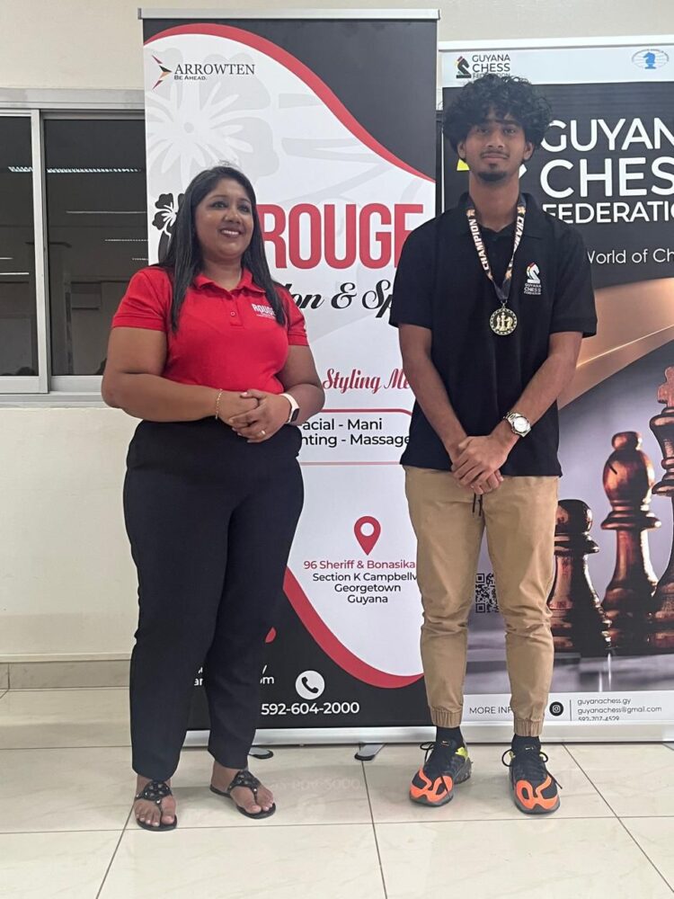 2025 National Junior Chess Championship qualifier Winner Kyle Couchman with Rouge Salon and Spa's Pritima Balgobin