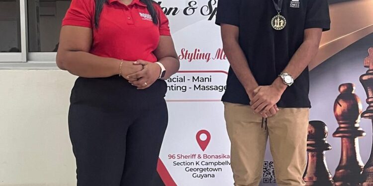 2025 National Junior Chess Championship qualifier Winner Kyle Couchman with Rouge Salon and Spa's Pritima Balgobin