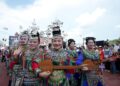 Cheerleading squad in ethnic costumes attend the restart ceremony of the "Village Super League" on July 26, 2025. (Photo by Long Jianrui/Xinhua)