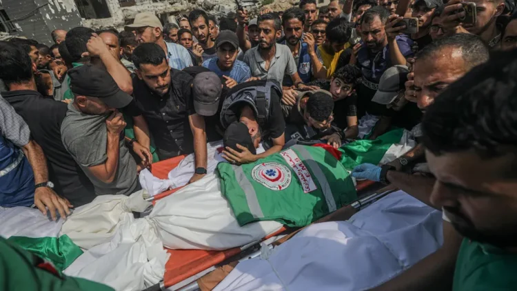 Palestinians attend the funeral of journalists killed in an Israeli strike