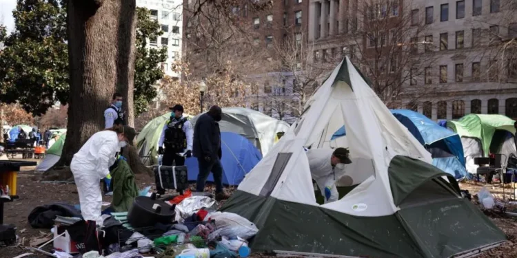A tent encampment being removed from downtown Washington DC in 2023