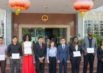 Chief Medical Officer, Dr Narine Singh, Chinese Ambassador to Guyana, Yang Yang, and the 6 scholarship recipients