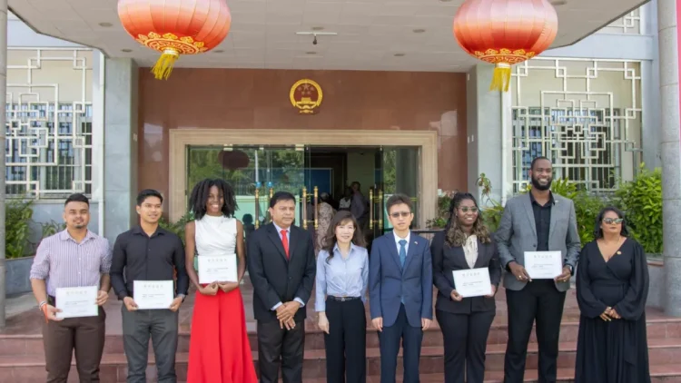 Chief Medical Officer, Dr Narine Singh, Chinese Ambassador to Guyana, Yang Yang, and the 6 scholarship recipients