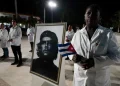 An image of late revolutionary hero Ernesto ‘Che’ Guevara is displayed during a farewell ceremony of Cuban doctors heading to Turkiye to assist in earthquake relief, in Havana, Cuba, in February 2023 [Alexandre Meneghini/Reuters]