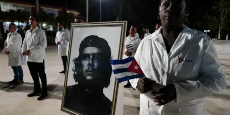 An image of late revolutionary hero Ernesto ‘Che’ Guevara is displayed during a farewell ceremony of Cuban doctors heading to Turkiye to assist in earthquake relief, in Havana, Cuba, in February 2023 [Alexandre Meneghini/Reuters]