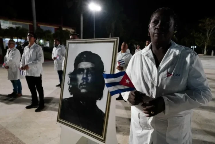 An image of late revolutionary hero Ernesto ‘Che’ Guevara is displayed during a farewell ceremony of Cuban doctors heading to Turkiye to assist in earthquake relief, in Havana, Cuba, in February 2023 [Alexandre Meneghini/Reuters]