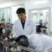 Yang Wei (L), a researcher at the Institute of Geology and Geophysics under the Chinese Academy of Sciences, studies lunar samples with his colleague in Beijing, China. /CMG