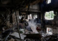 A firefighter works at the site of an apartment building hit by a Russian drone strike. REUTERS/Sofiia Gatilova Purchase Licensing Rights