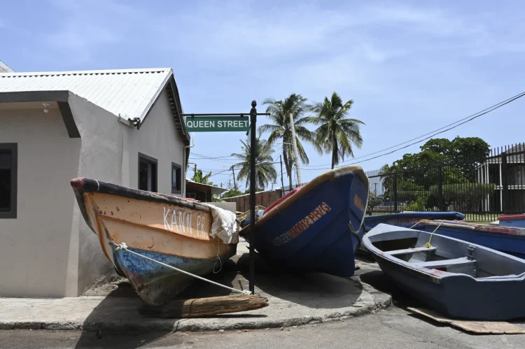 Fishing boat lie in the middle of the street for protection from Hurricane Beryl, Kingston JA. Collin Reid